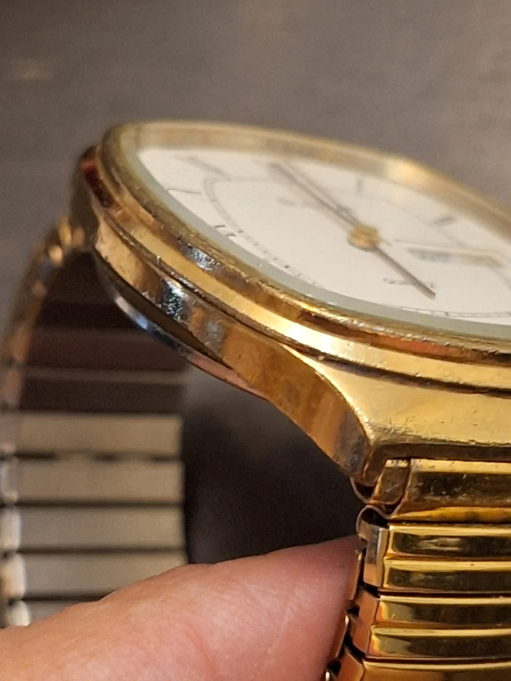 Bulova Gold and White Dress Watch with Roman Numerals‎